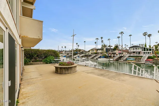 a view of a lake with boats and small boats