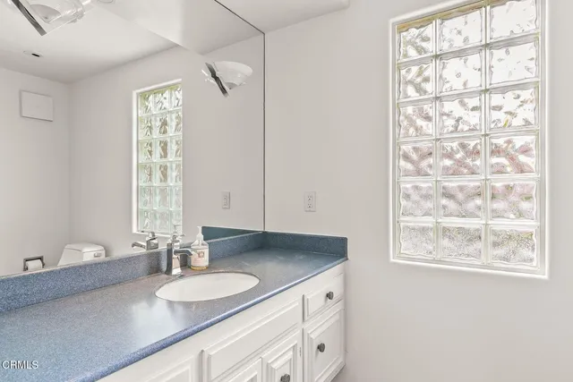 a bathroom with a bath tub with shower
