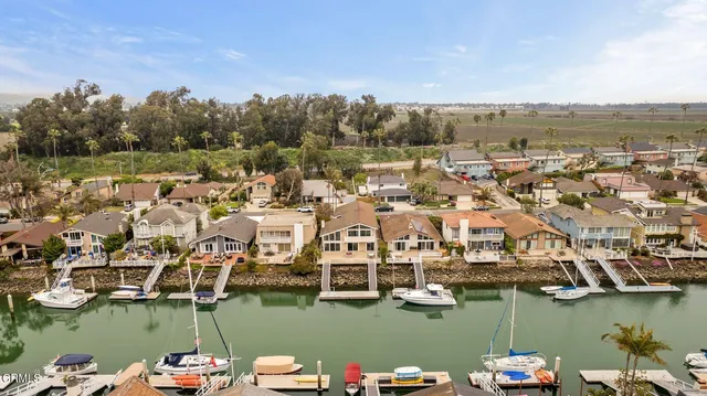 an aerial view of residential building with ocean view