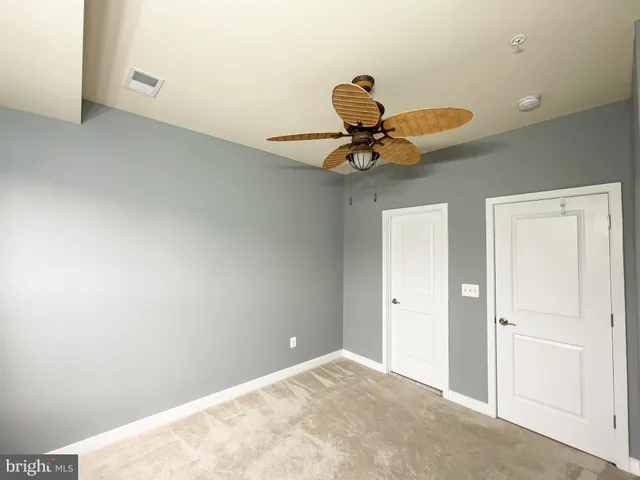 a view of a livingroom with a ceiling fan