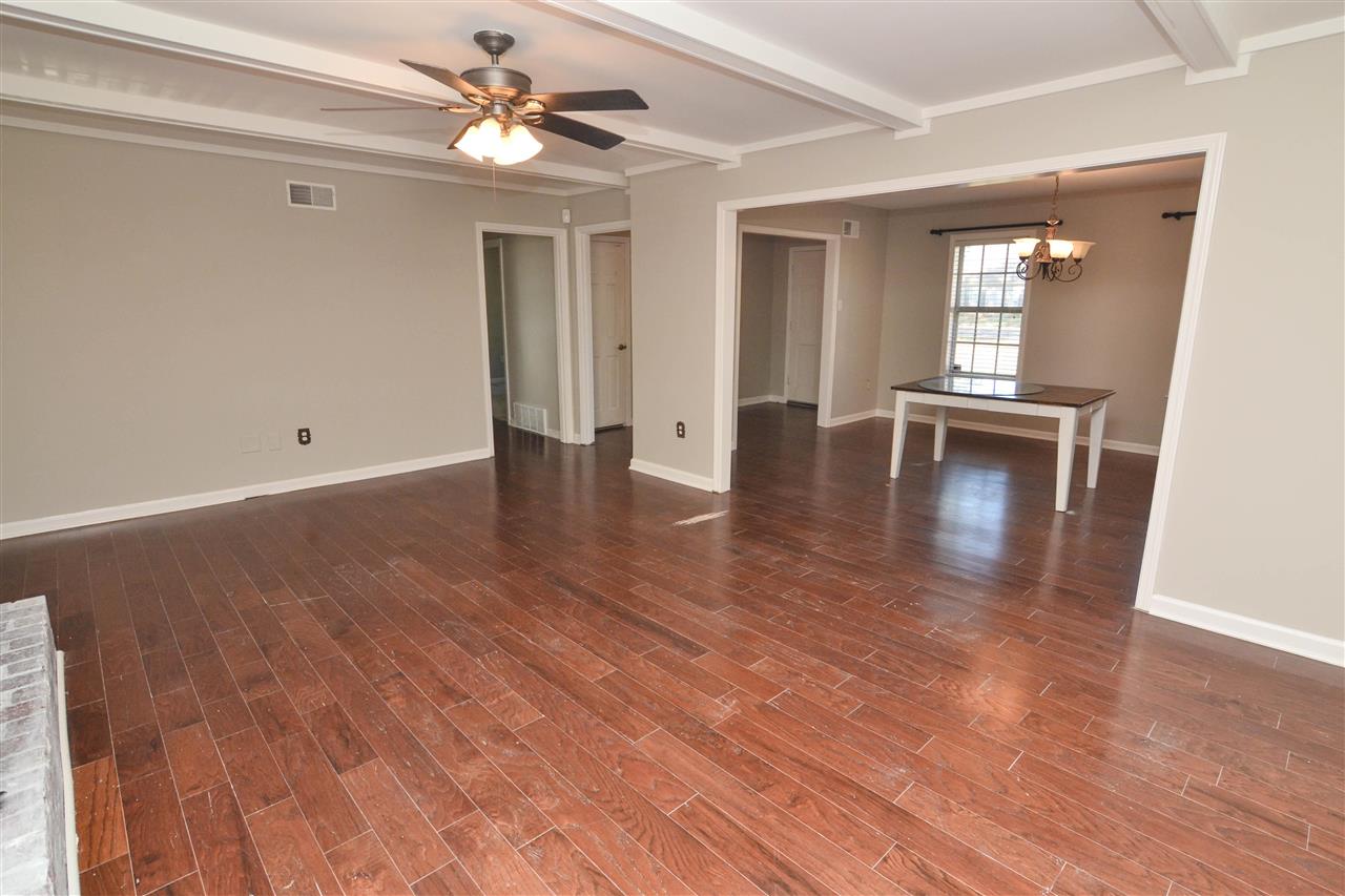 581 Fletcher Road Collierville, TN 38017 - Photo 8 of 19 a view of empty room with wooden floor and fan