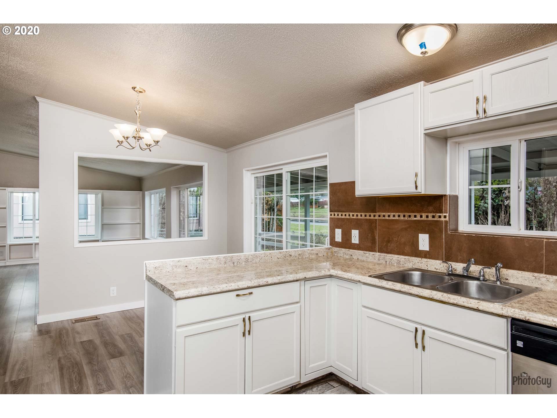 1053 South 58th Street Springfield, OR 97478 - Photo 13 of 32 a kitchen with a sink and large window
