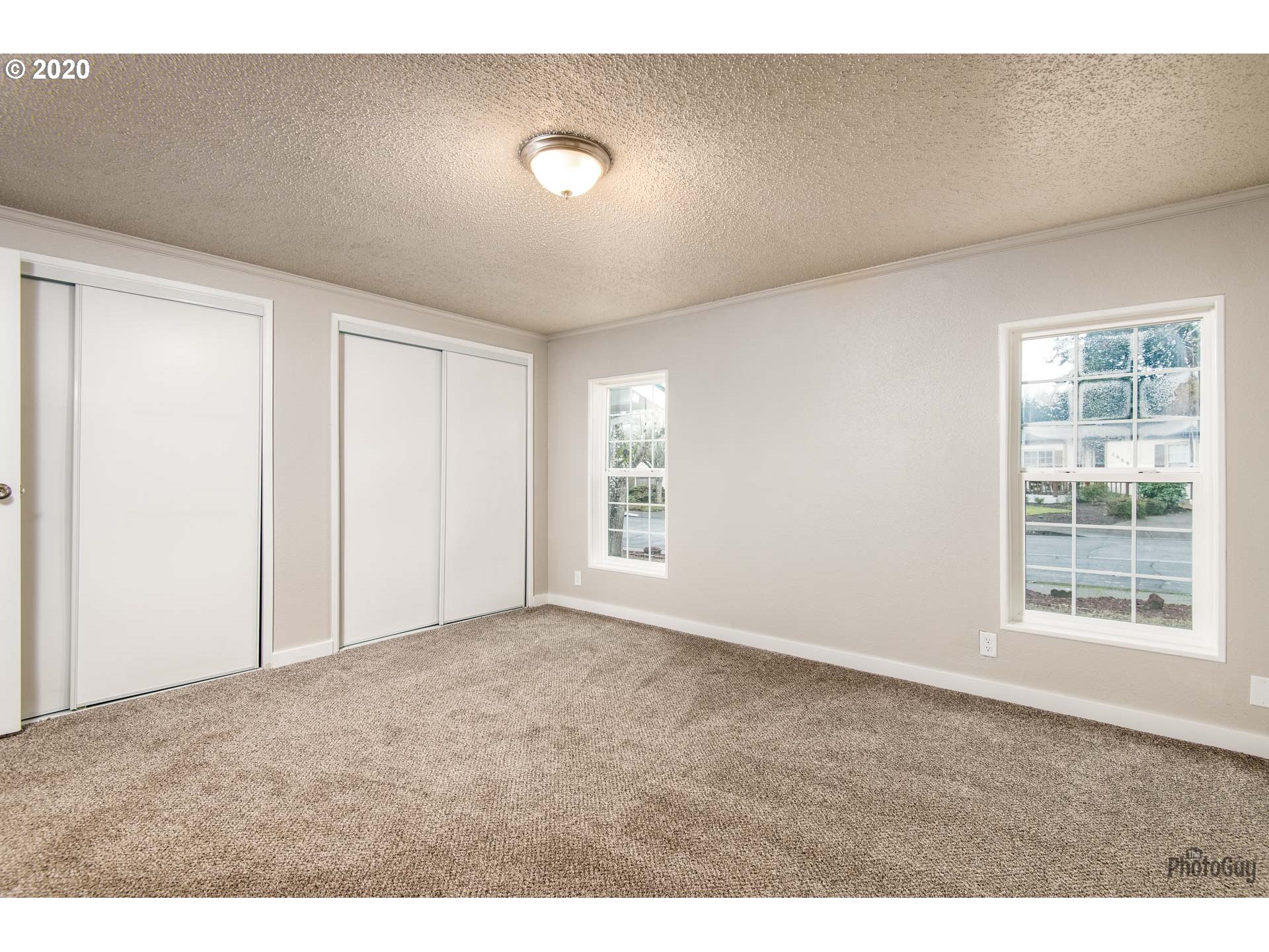 1053 South 58th Street Springfield, OR 97478 - Photo 19 of 32 a view of an empty room with a window