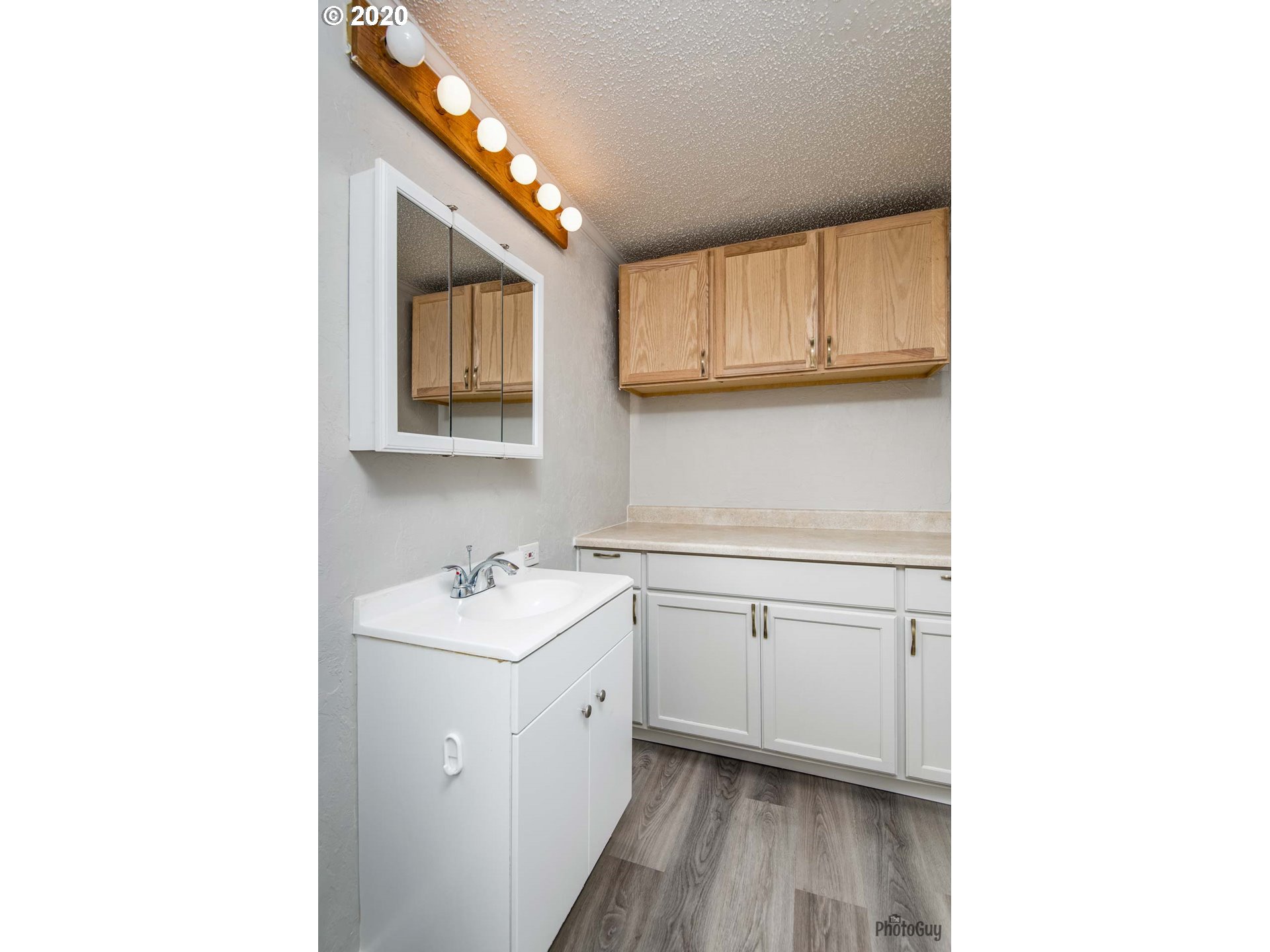 1053 South 58th Street Springfield, OR 97478 - Photo 20 of 32 a kitchen with a sink cabinets and a window