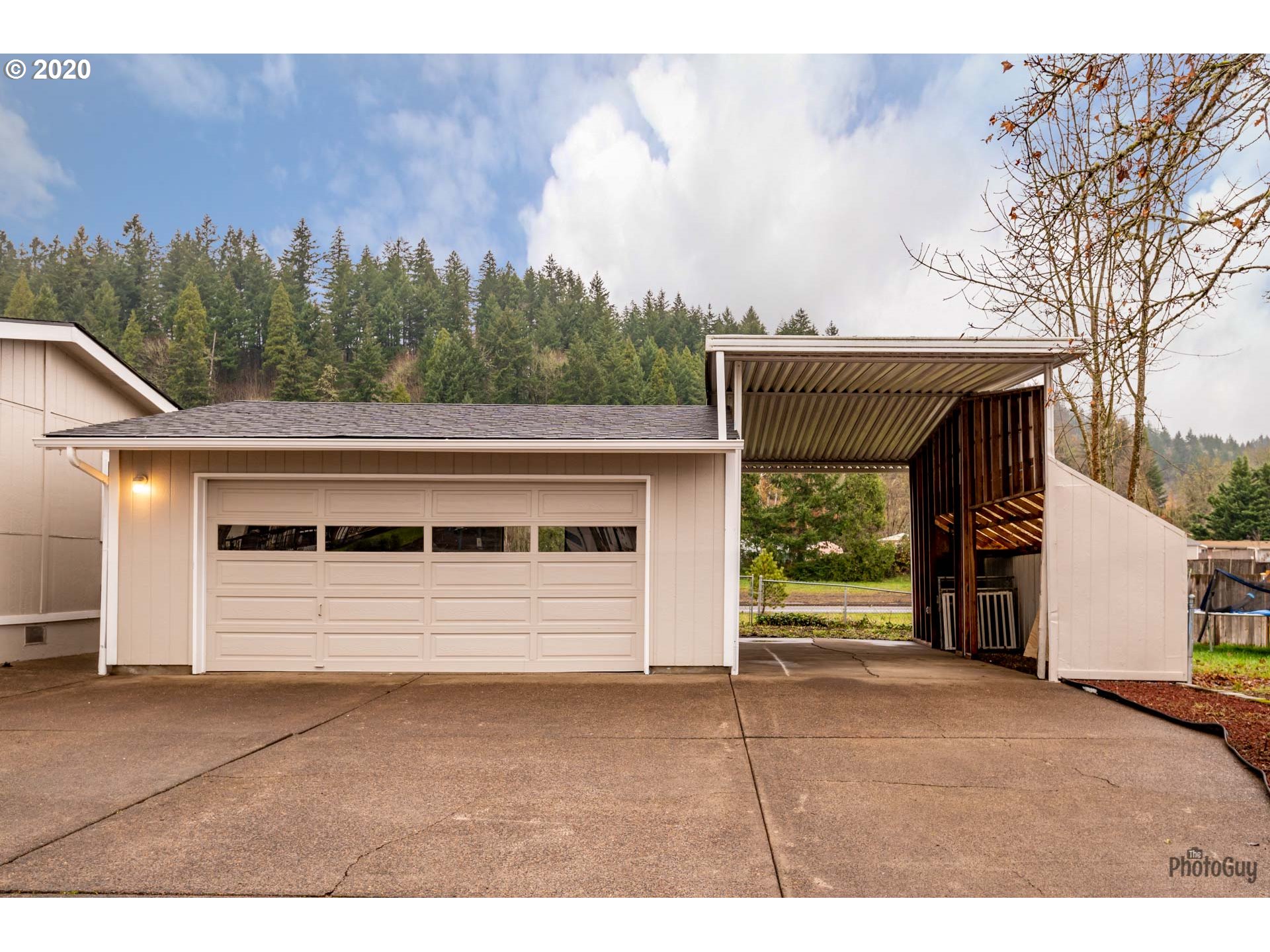 1053 South 58th Street Springfield, OR 97478 - Photo 32 of 32 a front view of a house with a yard and garage
