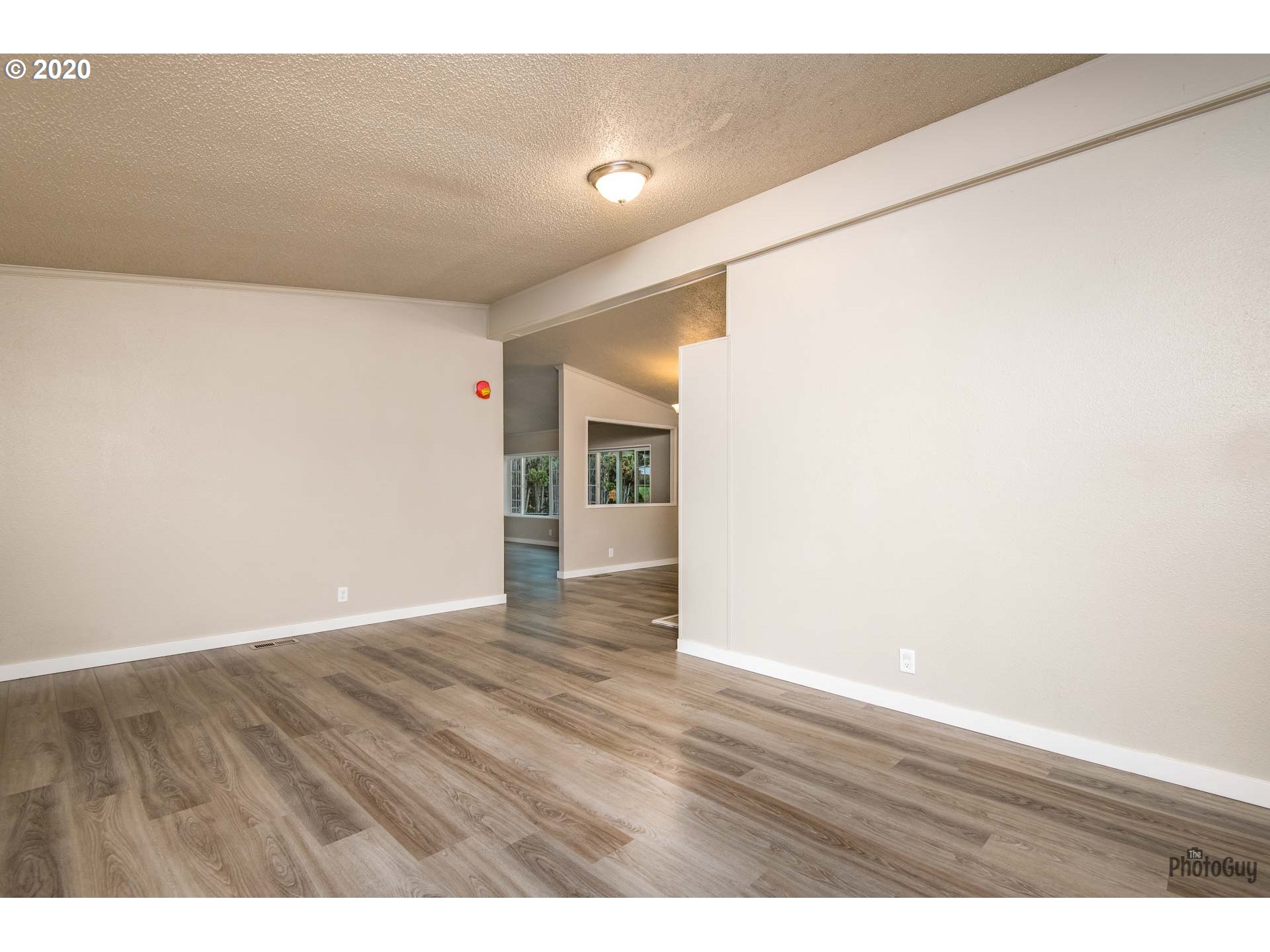 1053 South 58th Street Springfield, OR 97478 - Photo 5 of 32 a view of an empty room with wooden floor