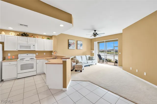 a kitchen with a sink cabinets and window