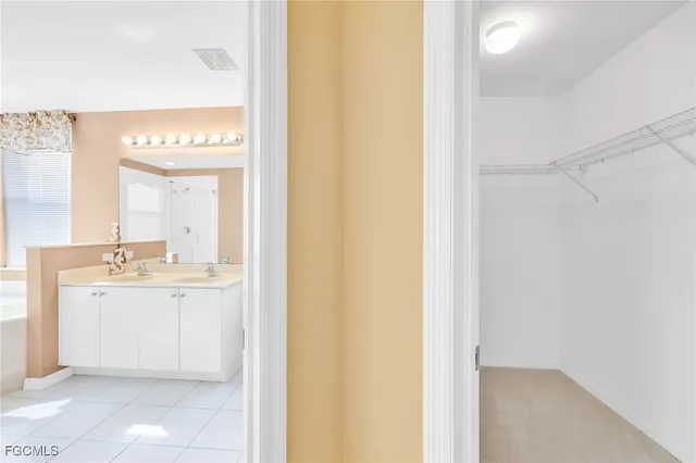 a bathroom with a sink a mirror and a bathtub