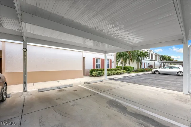 a building exterior with a car parked