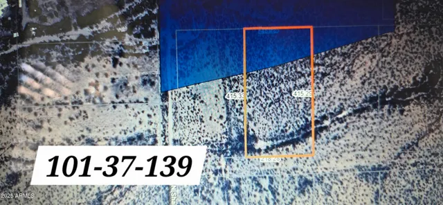 a sign board with wooden fence