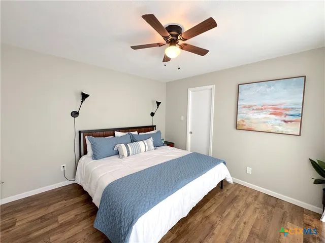 a bed room with a bed and a chandelier