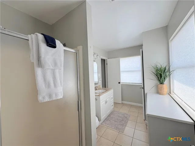 a view of a swimming pool with a lounge chairs