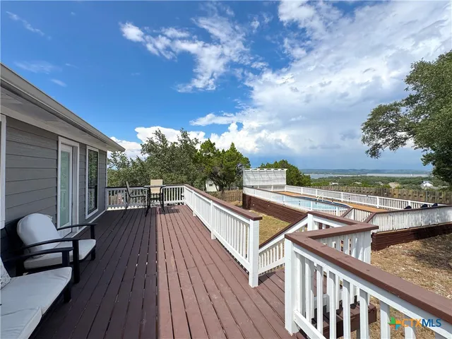 a bedroom with bed and painting on the wall