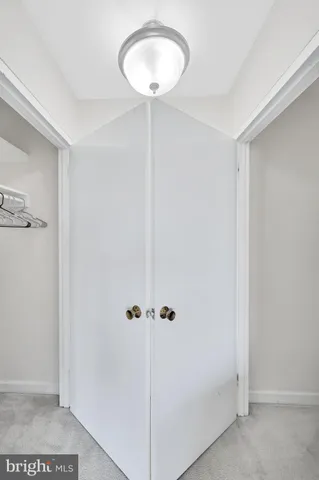 a backyard of a house with lots of green space and fountain