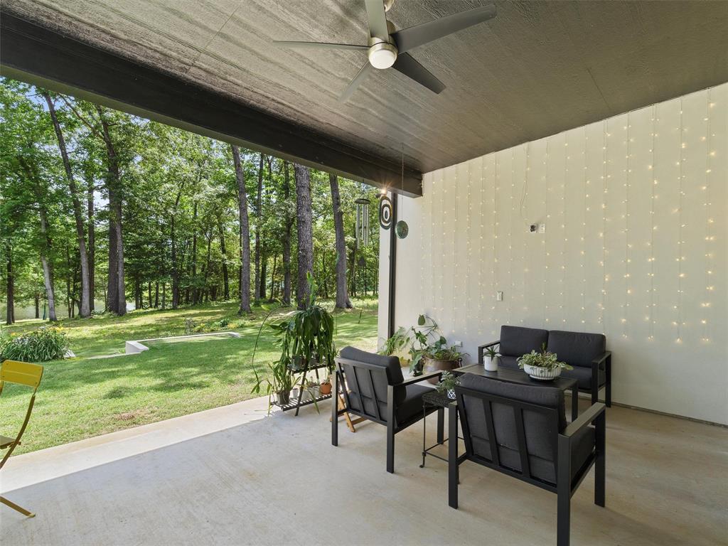 800 John Dean Road Gilmer, TX 75644 - Photo 39 of 40 a backyard of a house with table and chairs