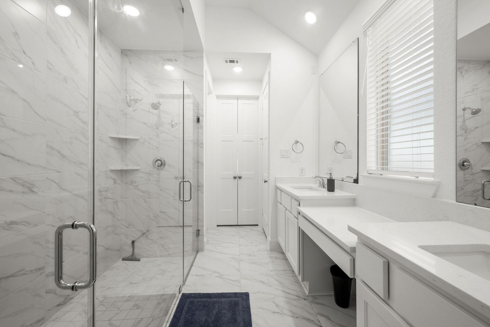 13035 Wandering Rdg Lane Conroe, TX 77302 - Photo 17 of 28 a bathroom with a double vanity sink a toilet and shower