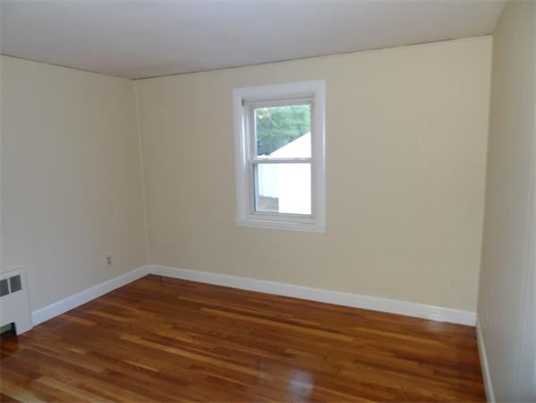15 Dustin Road Reading, MA 01867 - Photo 5 of 11 a view of a small space with wooden floor and a window