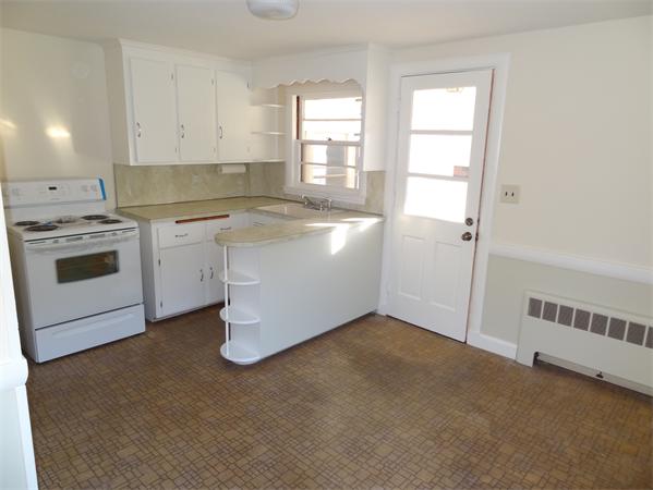 15 Dustin Road Reading, MA 01867 - Photo 8 of 11 a kitchen with a sink cabinets and window