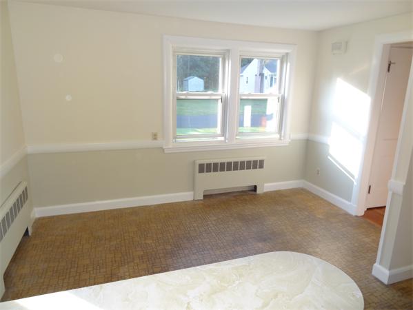 15 Dustin Road Reading, MA 01867 - Photo 9 of 11 an empty room with windows