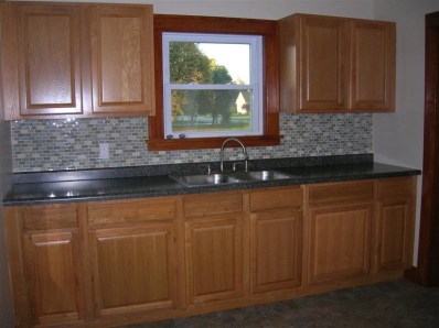 9428 Kleinman Road Highland, IN 46322 - Photo 3 of 10 a kitchen with granite countertop cabinets and window