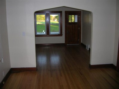 9428 Kleinman Road Highland, IN 46322 - Photo 4 of 10 an empty room with wooden floor and windows