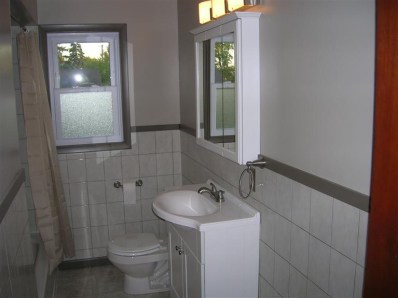 9428 Kleinman Road Highland, IN 46322 - Photo 7 of 10 a bathroom with a toilet sink and shower