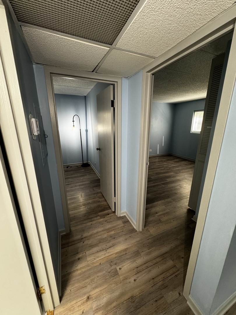3220 Sanders Road, Unit 1A Northbrook, IL 60062 - Photo 3 of 8 a view of hallway with wooden floor