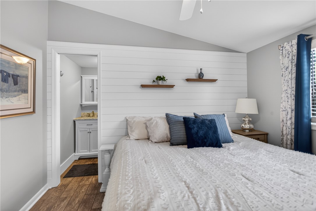 1230 Melton Road, Unit 4 West Union, SC 29696 - Photo 24 of 48 Wood flooring extends into this cozy sleeping space with a bright, en-suite bathroom.