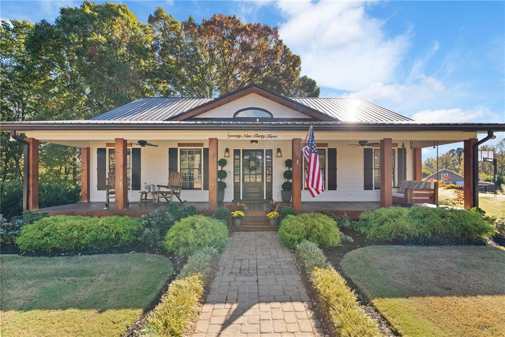 7933 Midway Road Alpharetta, GA 30004 - Photo 17 of 101 a front view of a house with garden