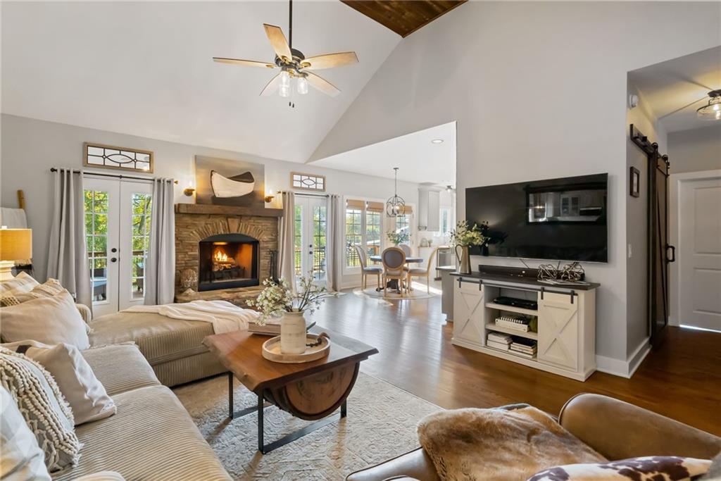 7933 Midway Road Alpharetta, GA 30004 - Photo 30 of 101 a living room with furniture flat screen tv and a fireplace