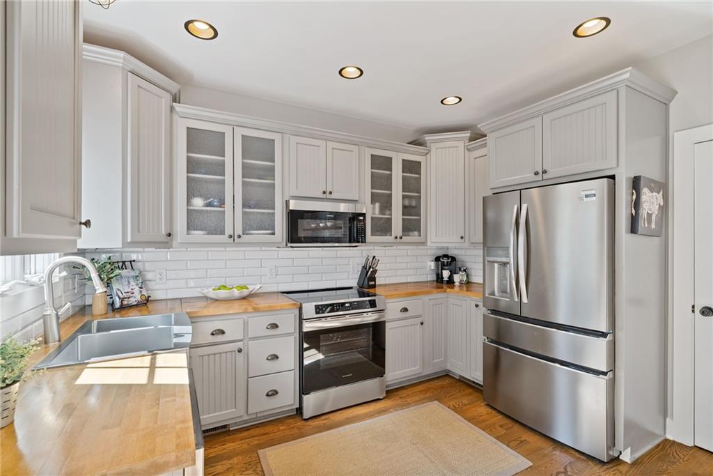 7933 Midway Road Alpharetta, GA 30004 - Photo 39 of 101 a kitchen with stainless steel appliances a refrigerator sink and microwave
