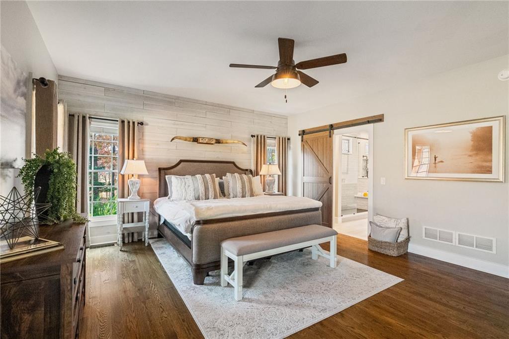 7933 Midway Road Alpharetta, GA 30004 - Photo 43 of 101 a bed room with a bed and a chandelier