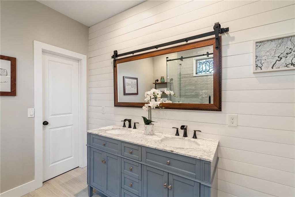 7933 Midway Road Alpharetta, GA 30004 - Photo 49 of 101 a bathroom with a granite countertop sink mirror and double