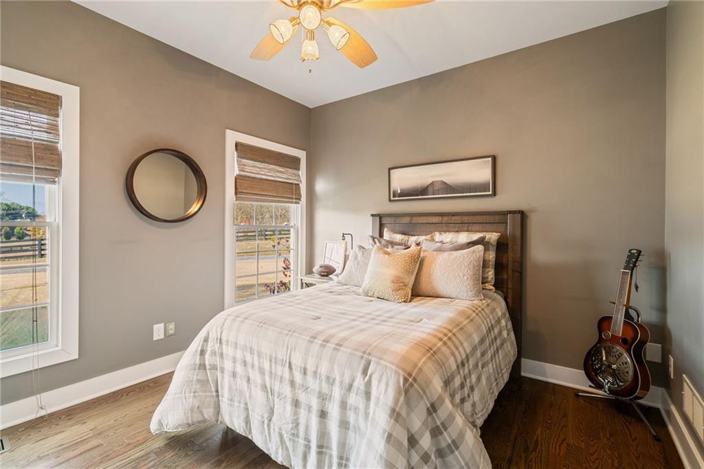 7933 Midway Road Alpharetta, GA 30004 - Photo 53 of 101 a bedroom with a bed and a chandelier