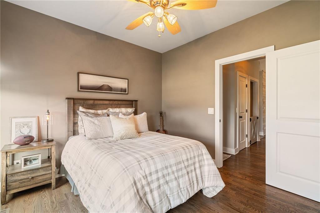 7933 Midway Road Alpharetta, GA 30004 - Photo 54 of 101 a bedroom with a bed and a chandelier