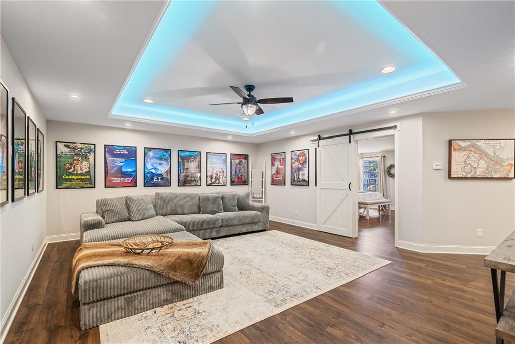 7933 Midway Road Alpharetta, GA 30004 - Photo 58 of 101 a living room with furniture and a wooden floor