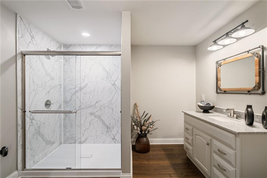 7933 Midway Road Alpharetta, GA 30004 - Photo 69 of 101 a bathroom with a sink and a mirror