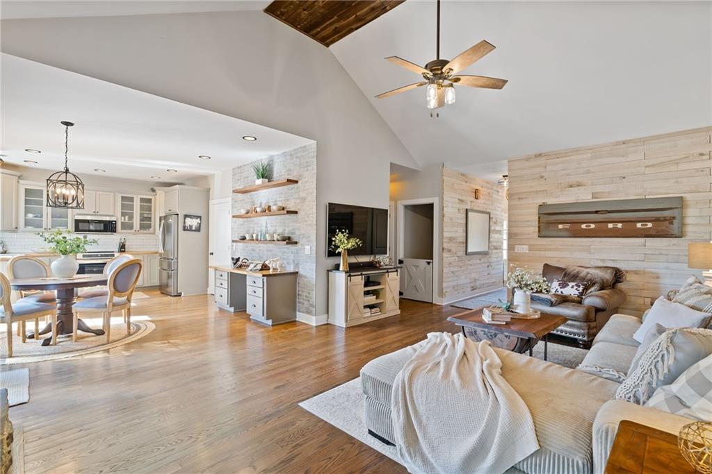 7933 Midway Road Alpharetta, GA 30004 - Photo 8 of 101 a living room with furniture and a flat screen tv