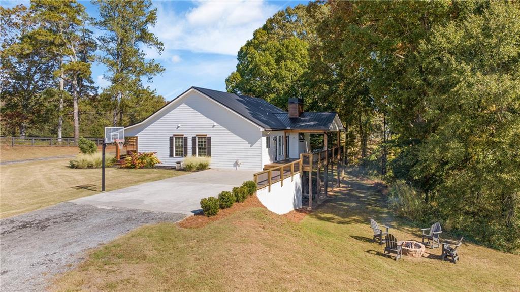 7933 Midway Road Alpharetta, GA 30004 - Photo 87 of 101 a view of a house with backyard and sitting area