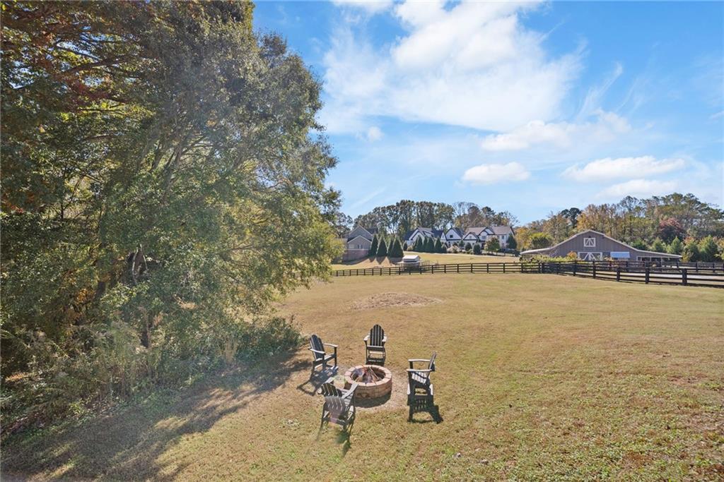 7933 Midway Road Alpharetta, GA 30004 - Photo 93 of 101 a view of a lake with table and chairs