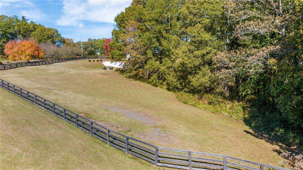 7933 Midway Road Alpharetta, GA 30004 - Photo 95 of 101 a view of a dry yard with wooden fence