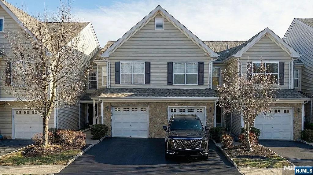 a front view of a house with yard