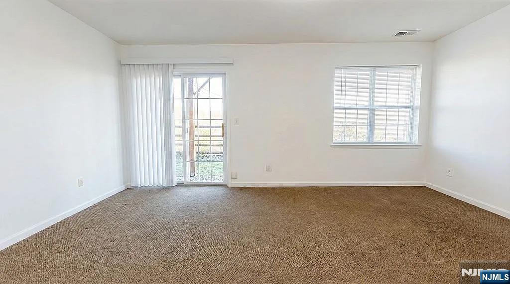 136 Mountainside Drive Pompton Lakes, NJ 07442 - Photo 14 of 36 an empty room with windows