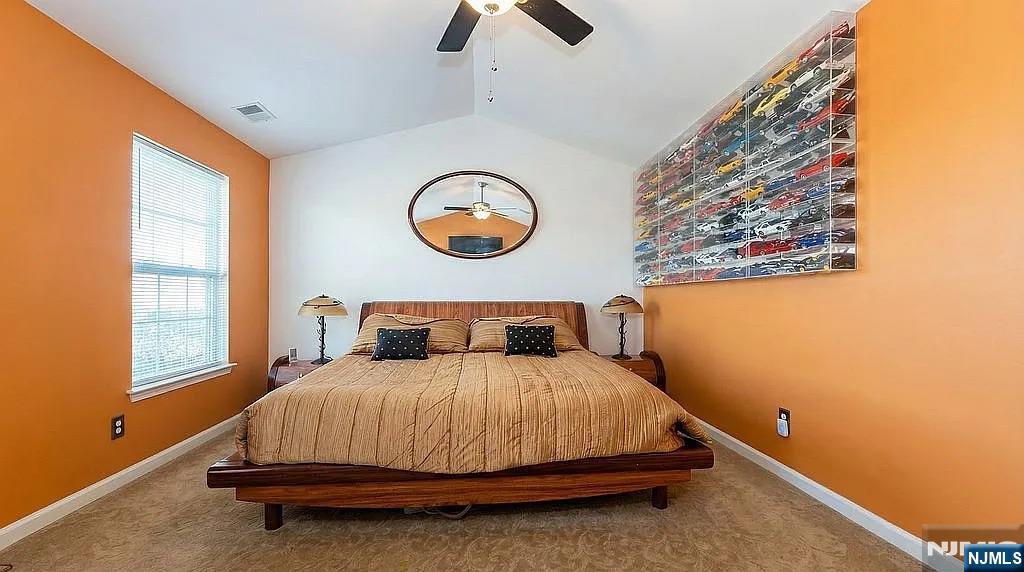 136 Mountainside Drive Pompton Lakes, NJ 07442 - Photo 20 of 36 a bedroom with a bed and window