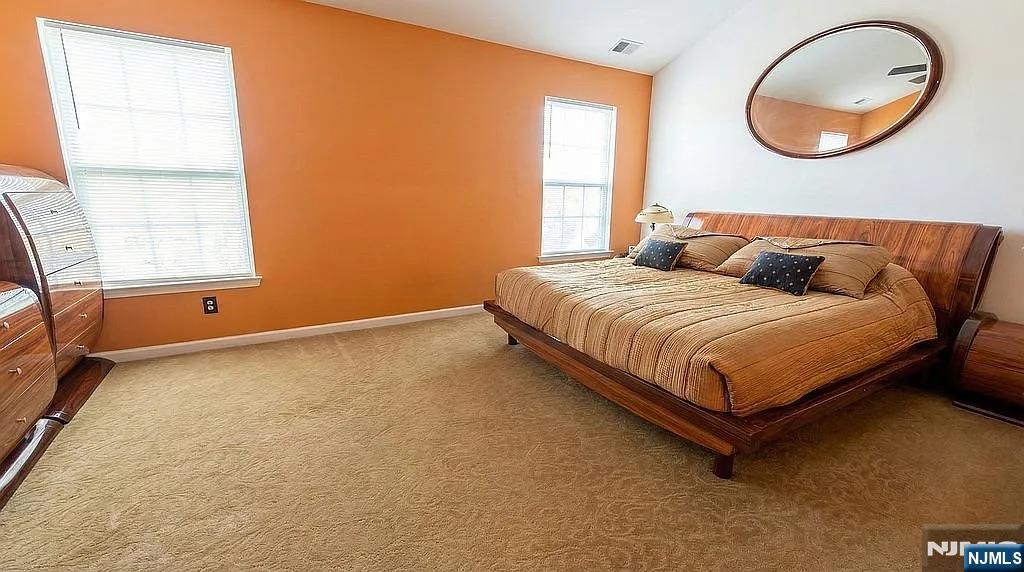 136 Mountainside Drive Pompton Lakes, NJ 07442 - Photo 21 of 36 a bedroom with a bed and a window