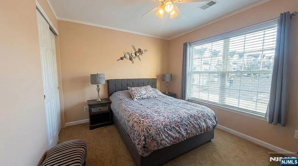136 Mountainside Drive Pompton Lakes, NJ 07442 - Photo 25 of 36 a bedroom with a bed and a window