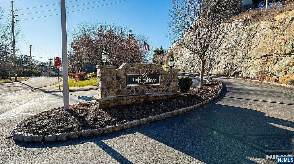 136 Mountainside Drive Pompton Lakes, NJ 07442 - Photo 3 of 36 a view of a wooden deck with a bench