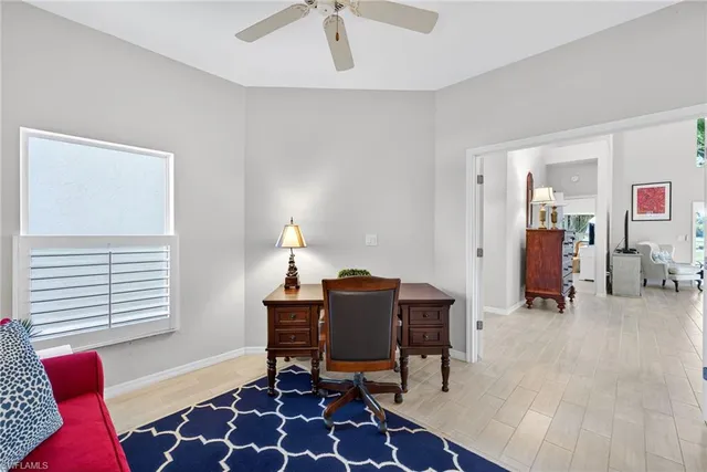 a workspace with furniture and window