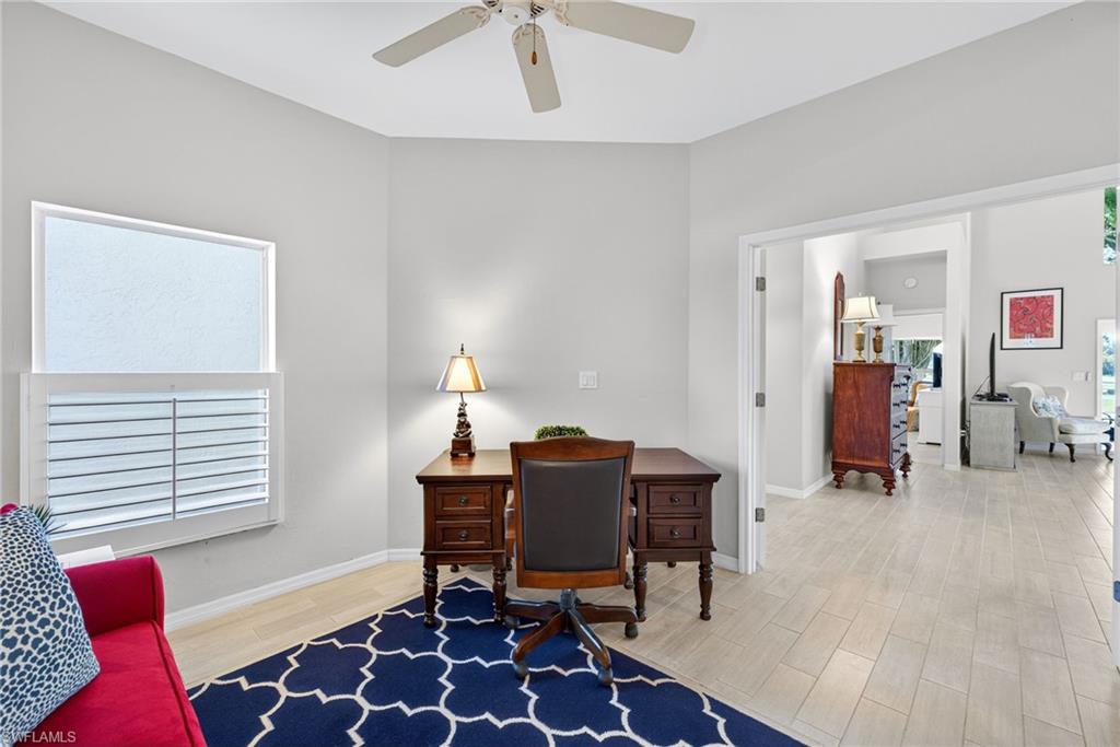 2193 Paget Circle, Unit 1 25 Naples, FL 34112 - Photo 15 of 50 a workspace with furniture and window
