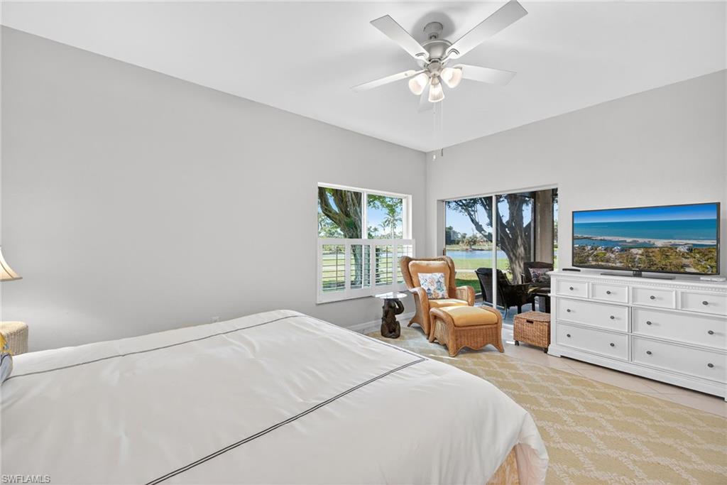 2193 Paget Circle, Unit 1 25 Naples, FL 34112 - Photo 17 of 50 a bedroom with a bed and furniture